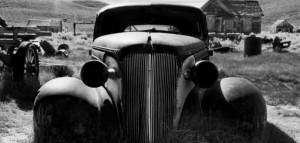 Abandoned vintage car in rural ghost town